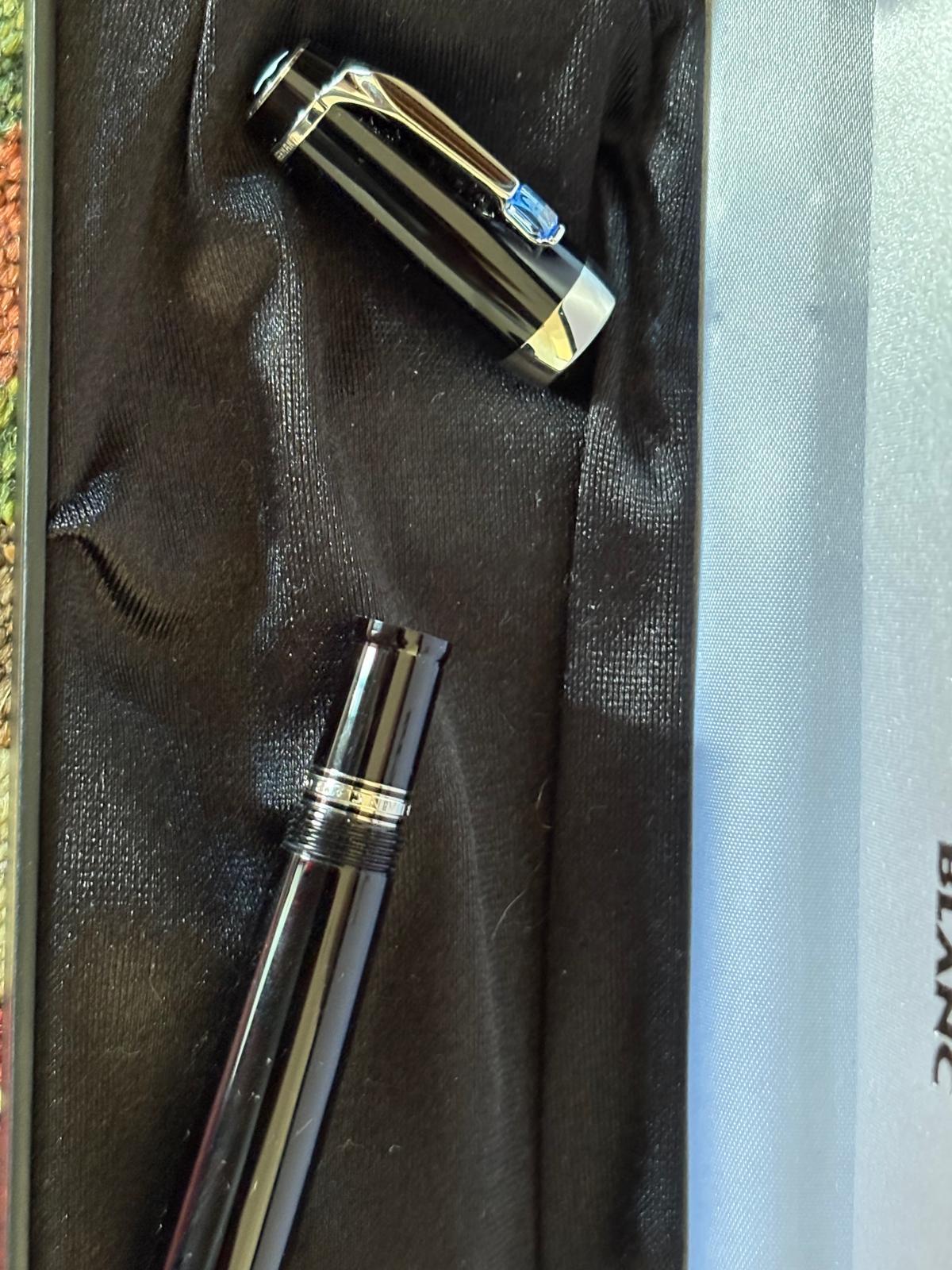 Montblanc black resin fountain pen with blue jewel clip