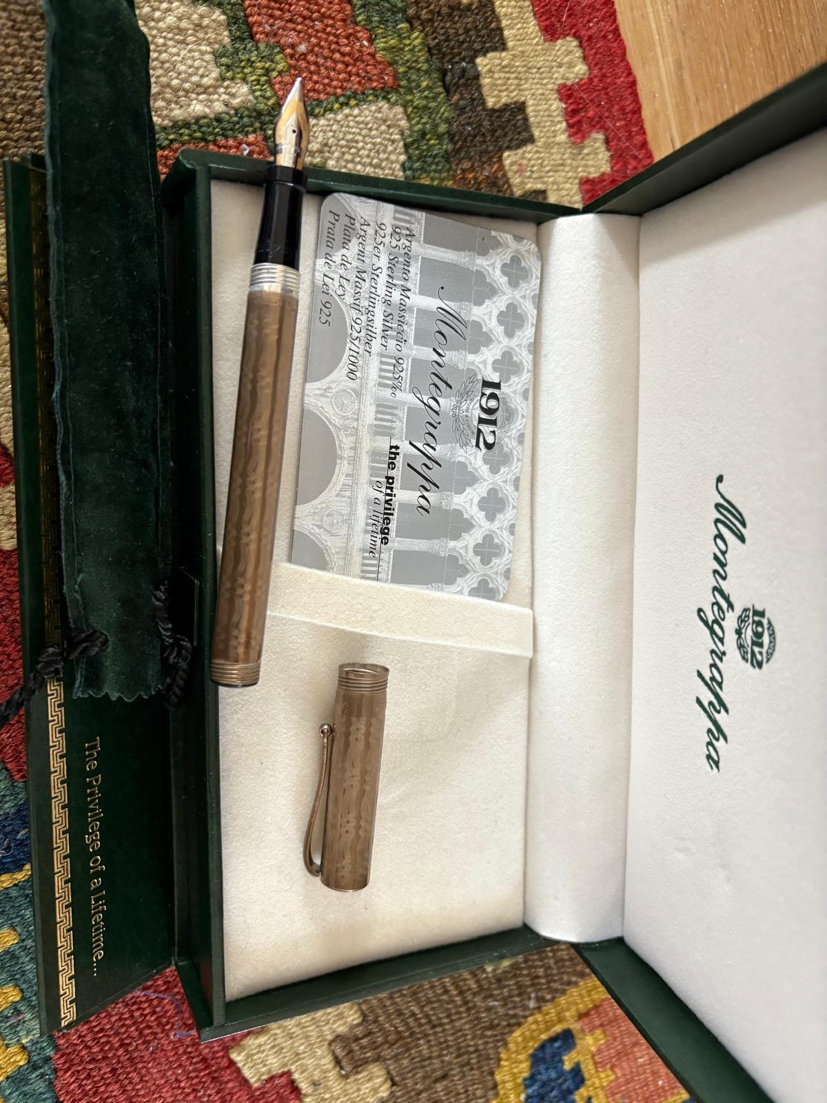 Montblanc silver-striped fountain pen with gold trim