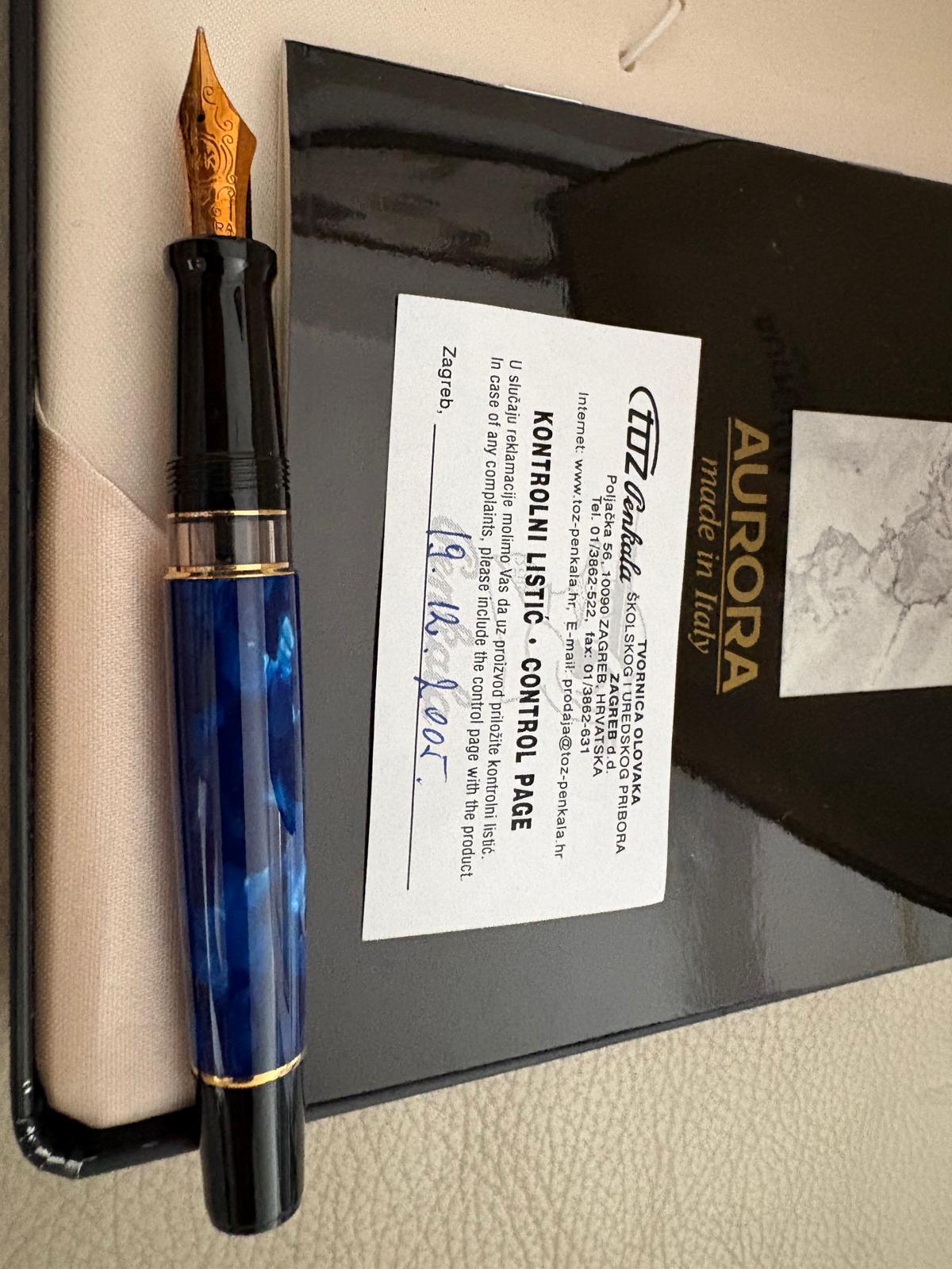 Representative photograph of the identical Aurora Optima 996B Blue Auroloide fountain pens with box and dated control card